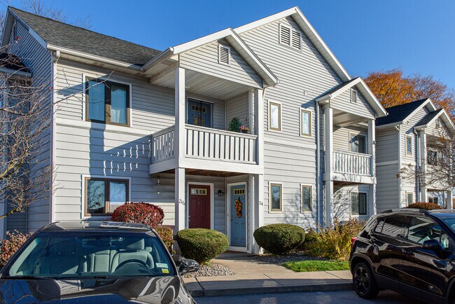 Apartment Exterior Showing Ground Floor Entrances & Second Floor Balcony