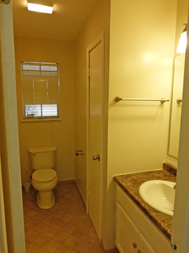 Hall bath has tile floor, utility closet - 55 Beech Hills House
