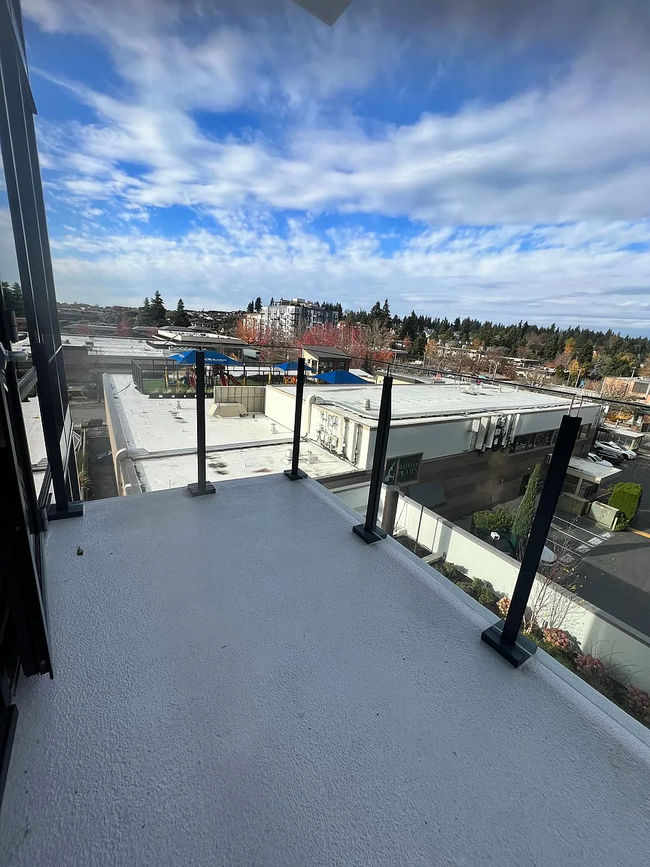 Enjoy the PNW views from your private balcony - 889 103rd Ave NE Apartment Unit 404