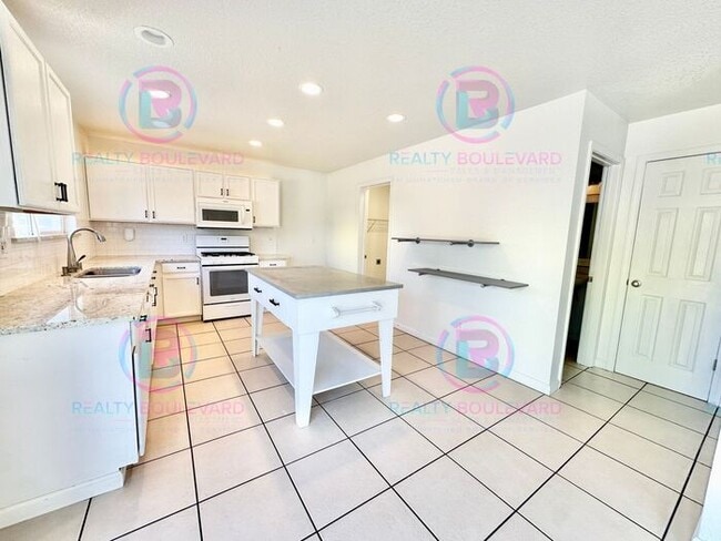 Photo - Gorgeous 4BR Home with Granite Counters, Open-Concept Living & 2 car garage