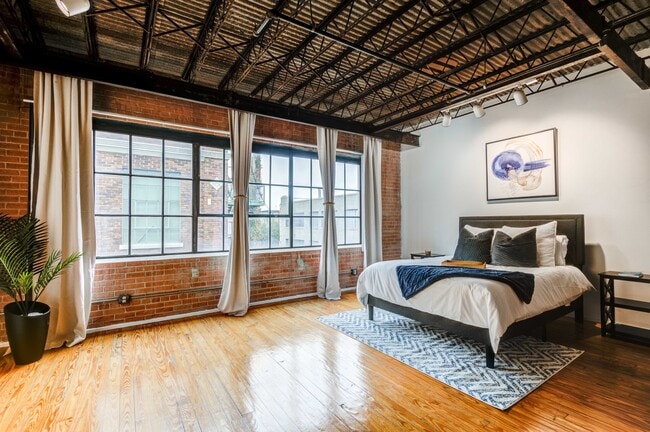 Renovated Lofts with exposed steel beams and brick accents