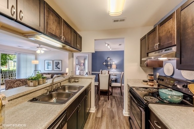 Fitted Kitchen With Island Dining - Brittany Commons Apartments
