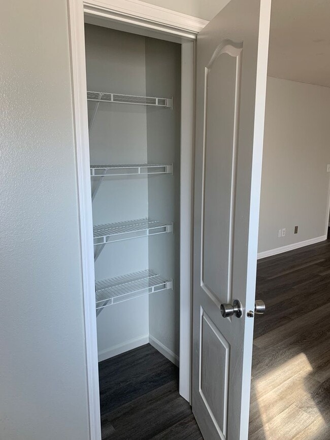 Photo - Super cute and updated with fresh paint, new floors, some fixtures, and all appliances.