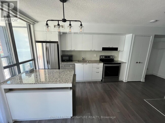 Photo - 110 Charles St E Unité 410