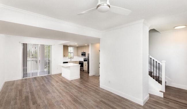 Spacious living rooms with ceiling fans - City Center On 7th