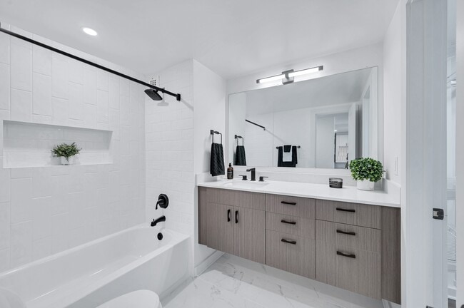 Spa inspired bathrooms with tiled shower and custom vanity