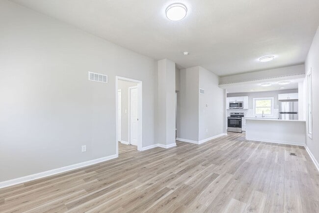 Photo - Remodeled 2-Bedroom Bungalow with Spacious Yard & 1-Car Basement Garage