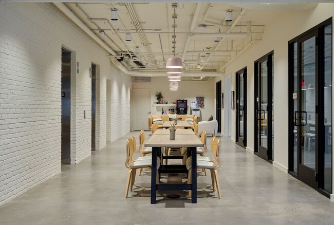 Community co-working area with private meeting rooms and offices