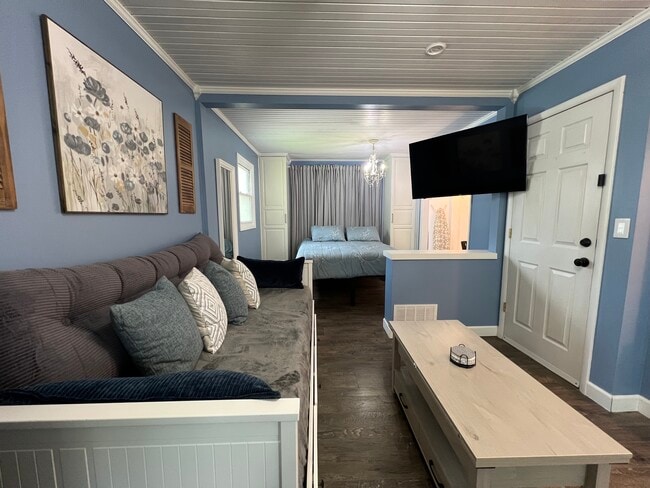 The swivel bracket on the t.v. allows you to watch from the couch or the bed! - 908 Lake Rd Unit New Lenox