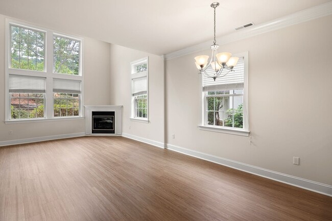 Photo - Five-Bedroom Tudor Home with Main-Level Primary Suite in Albemarle Reserve