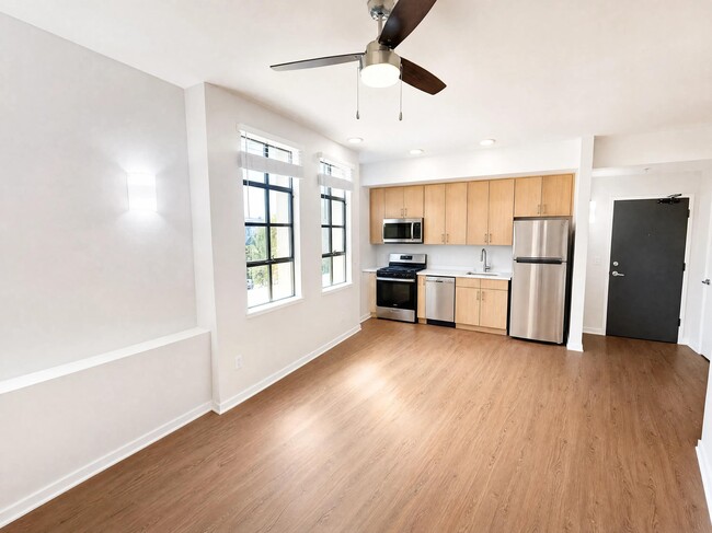 Redesigned kitchen with new cabinetry, upgraded stainless steel appliances, and a built-in dishwasher.