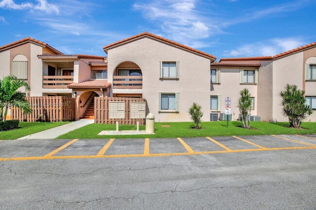 Building Photo - 8999 SW 123rd Ct Unit 107
