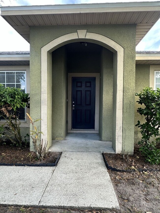 Photo - Spacious 4 bed 2 bath, 2 car garage with fenced-in backyard in Poinciana Neighborhood