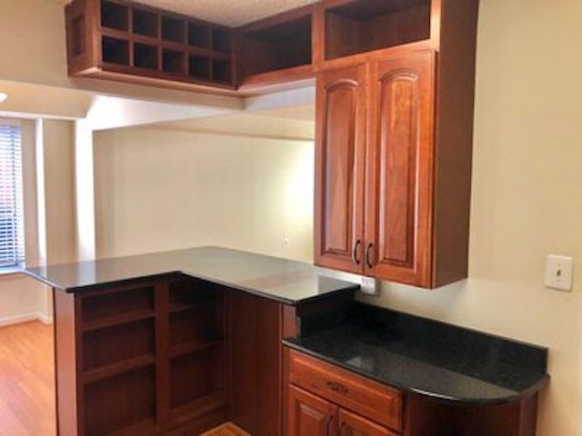 Granite kitchen bar with wine rack - 1045 31st St NW Unit 301