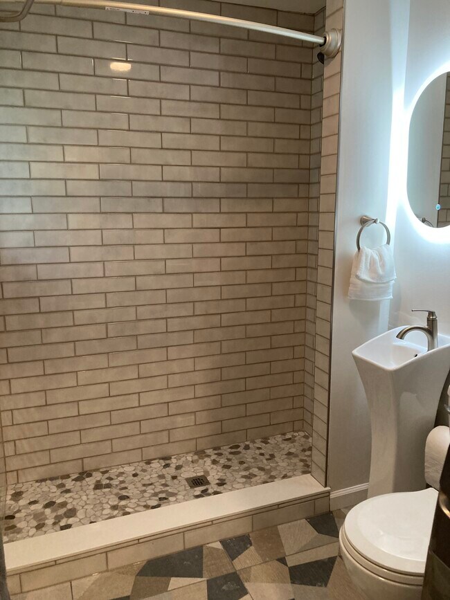 Beautiful tiles in first floor bathroom shower - 1417 N Hamilton Ave