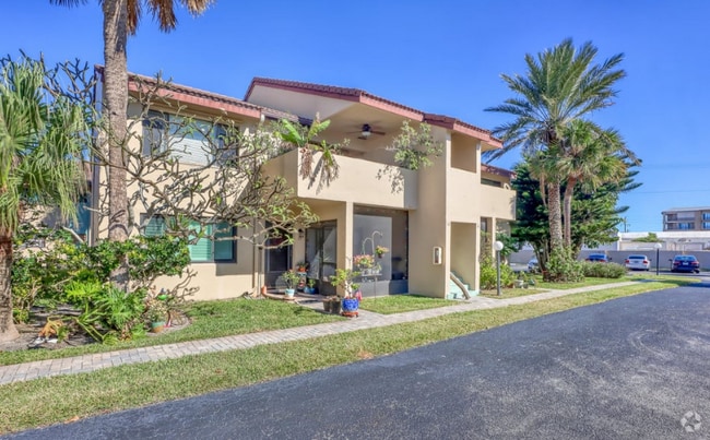 Building Photo - **Coastal Condo Living at Its Finest!** Unit 14