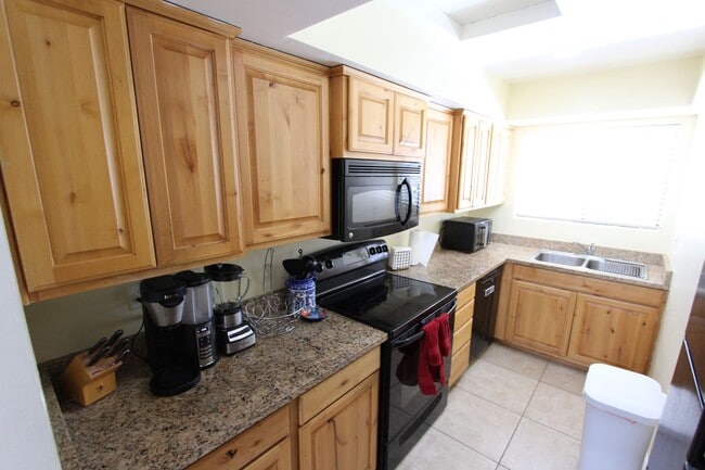 Photo - Fully Furnished 2BR Condo | Private Balcony + Covered Parking