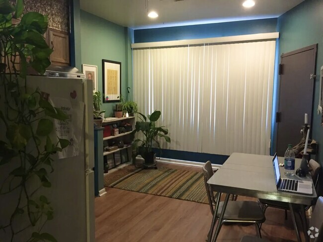 Kitchen area - angle/view from hallway area facing front window and apt entrance door - 1168 S 10th St Unit 1st floor Rental