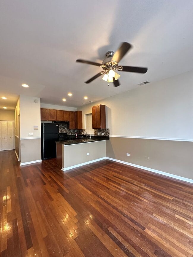 Building Photo - 7654 S Colfax Ave Unit 3