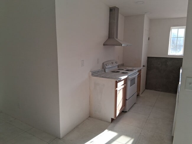 Photo - Large duplex with 3 car garage and made for blue collar folks.