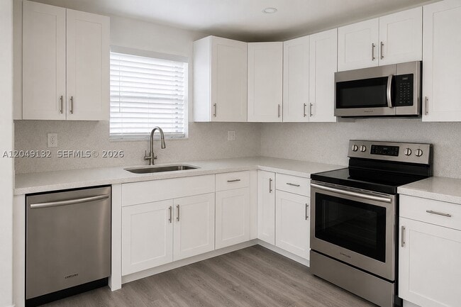 Building Photo - 6175 W 20th Ave Unit 306