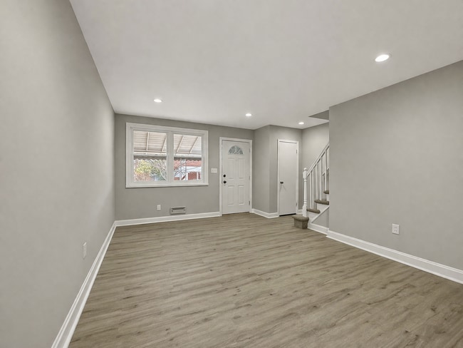 Photo - Updated 3BR Home with Bonus Lower-Level Space & Off-Street Parking