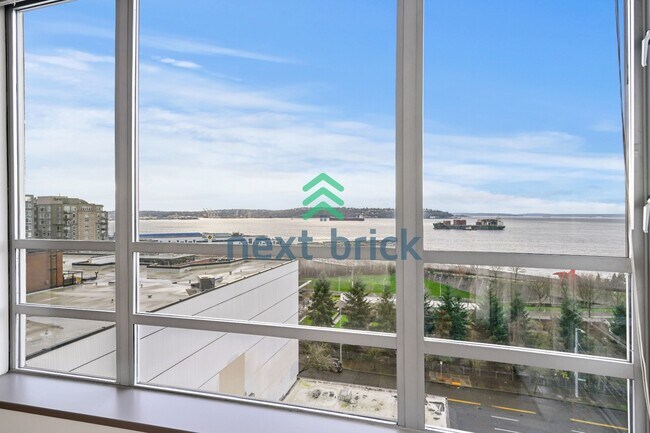 Photo - Stunning 2-Bed Corner Condo with Water and Mountain Views Unit 600
