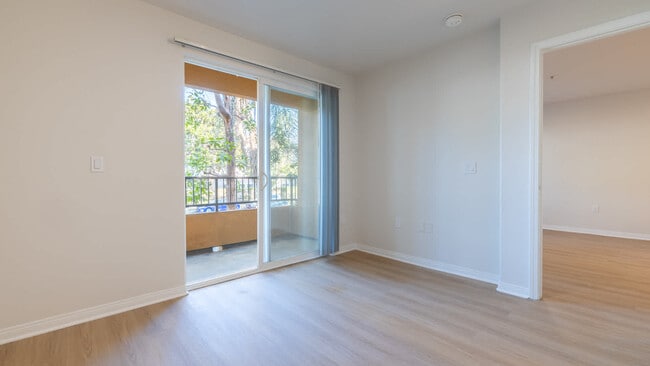 Bedroom with Balcony and Hard Surface Flooring