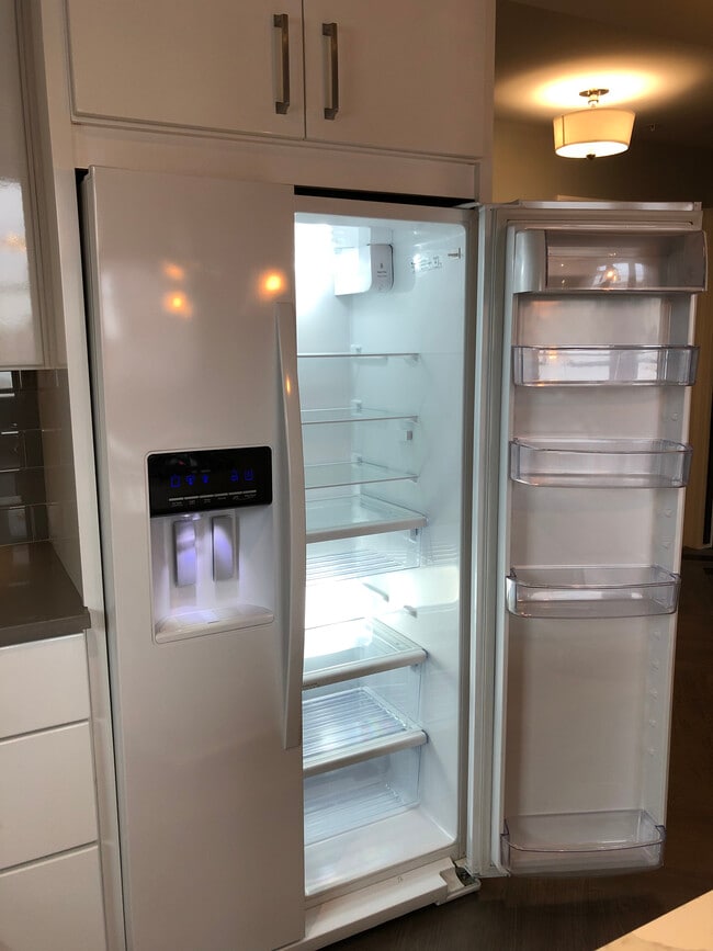Whirlpool side by side fridge with ice maker