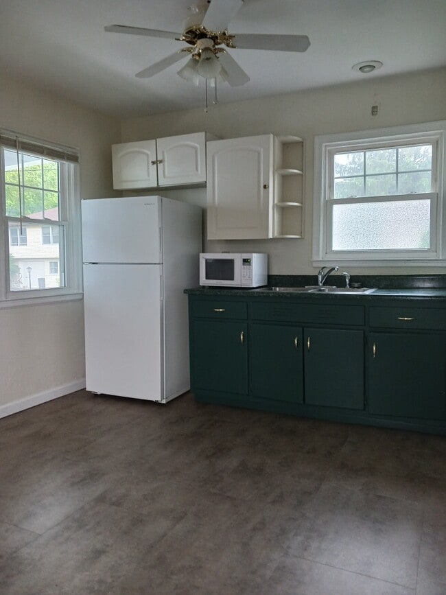 New flooring in kitchen. Light filled space - 32 Duquesne Ave Unit 32 Duquesne Avenue