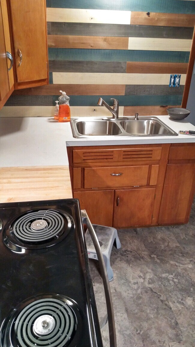 SS sink, cutting board part of countertop - 515 3rd Ave NW Unit 515