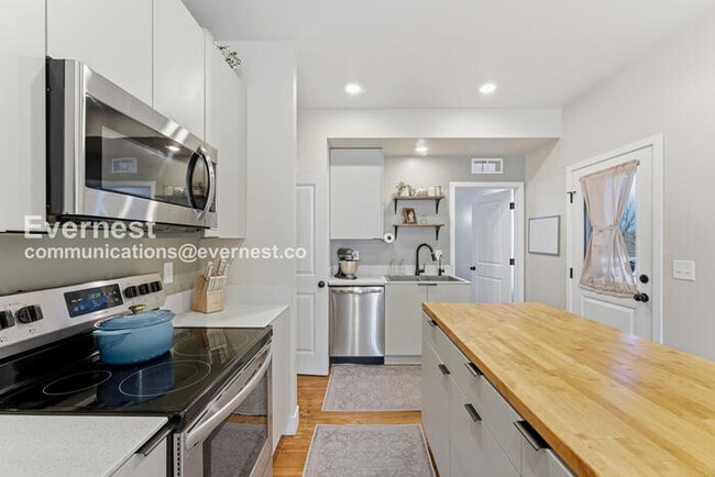 Photo - 4 Bed/3 Bath Townhome with Fenced Yard & Garage / Available Now!