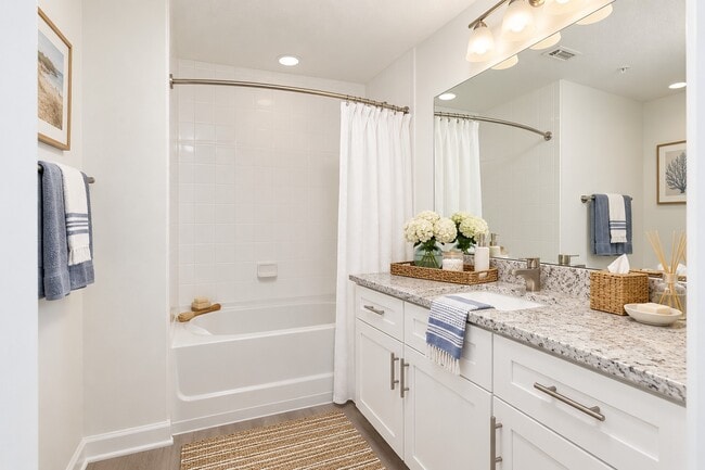 Elevate your daily routine in the stylish bathrooms of Quantum Lake Villas, featuring modern fixtures, spacious layouts, and elegant finishes. Enjoy the perfect blend of comfort and luxury. Schedule a tour today!
