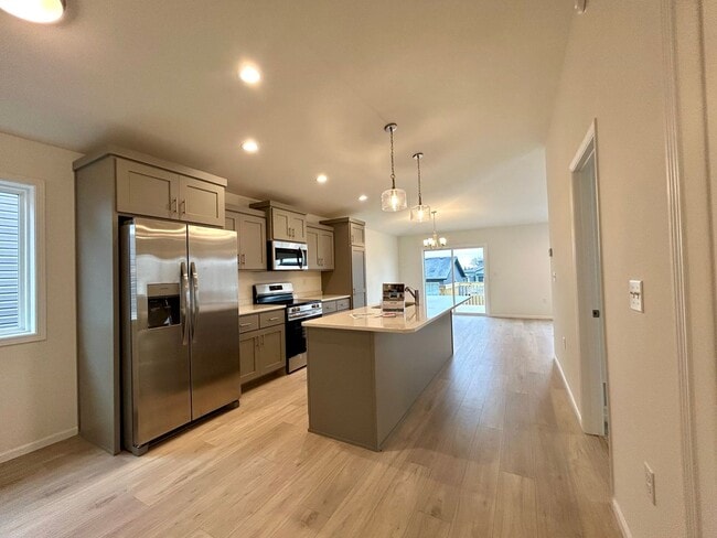 Photo - Spacious & Stylish 4-Bed Home with Modern Finishes and Attached 2-Stall Garage