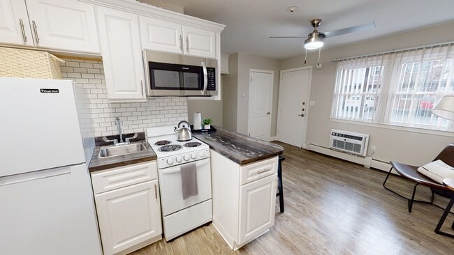 Enjoy the daily charm of our stylish modern kitchen with abundant cabinet space and a cozy breakfast bar.