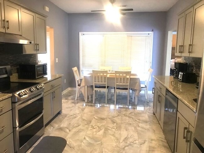 Photo - 4 Bedroom, 2.5 Bath, Pet Friendly Home with Fenced Yard & Sunroom! Available Soon!