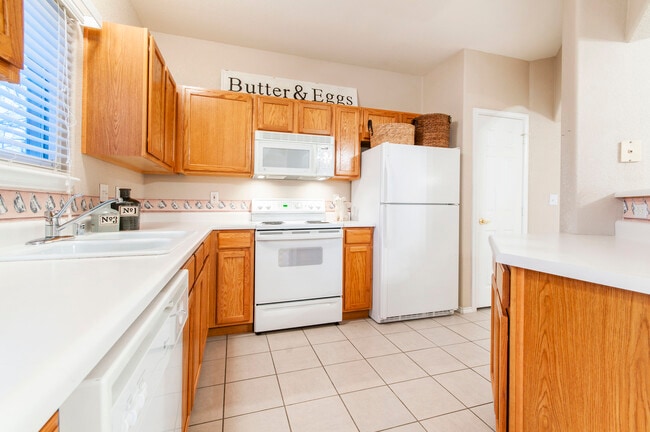 Spacious kitchen with pantry and equipped with stove, microwave, refrigerator, dishwasher and garbage disposal, - 3960 Riviera Grove Unit 101