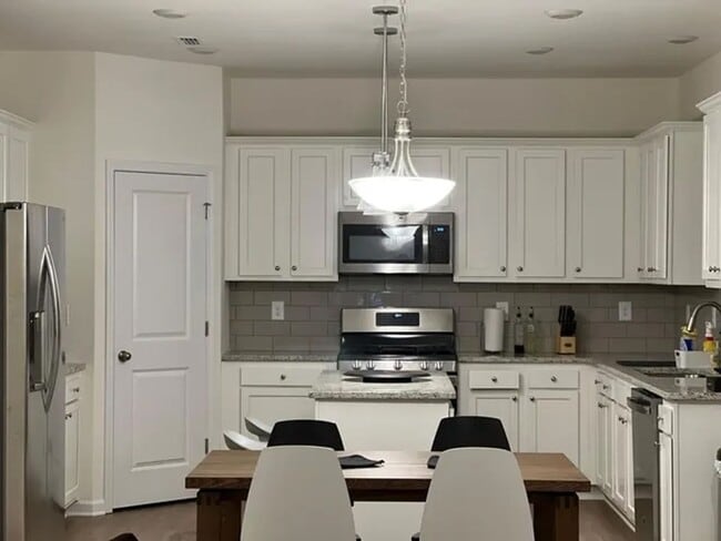 Photo - 2022 Four Bedroom Home Furnished