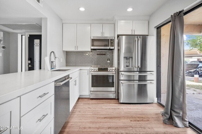 Building Photo - 9340 N 92nd St Unit 118 Rental