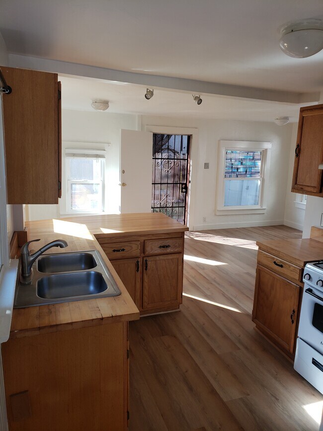 Front room/entry from the kithcen - 613 Broadway St Unit 613 and a half