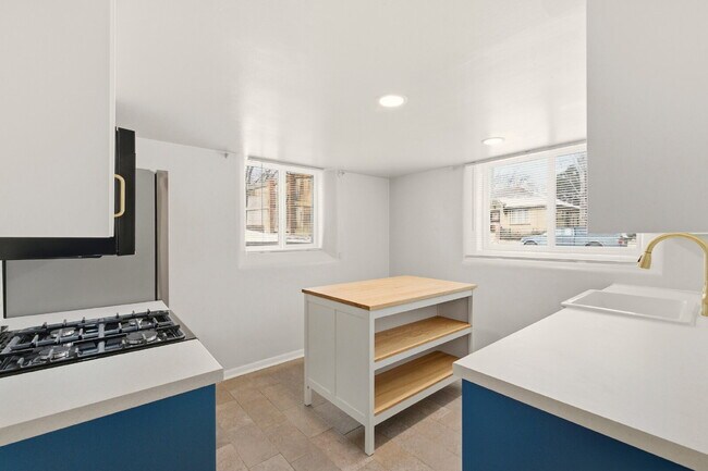 Photo - Renovated studio with garage + utilities included! Modern kitchen with island, updated bath, on-s...