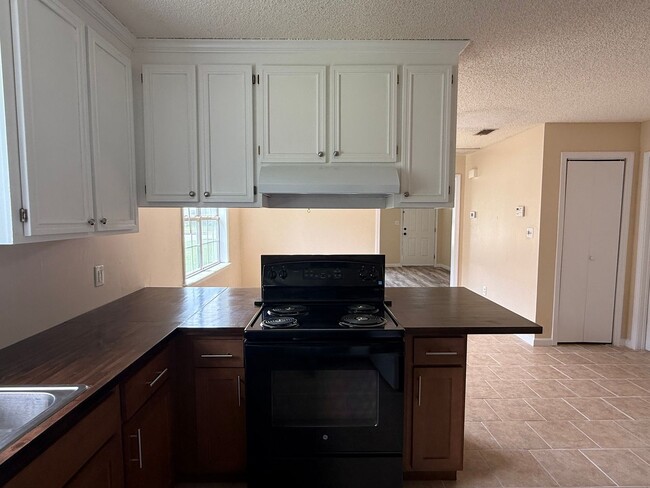 Photo - 3BR/2BA Single-Family Home with Versatile Bonus Room & No Carpet!