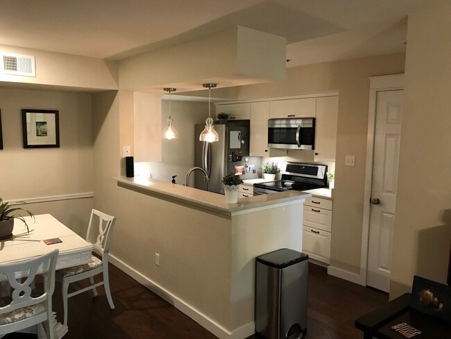 Newly remodeled kitchen with open layout. View from the front room - 3313 Wyndham Cir Unit 3203