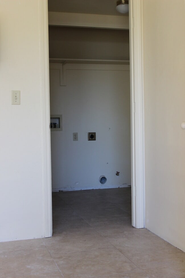 Laundry closet with hook ups for washer/dryer with bi-fold doors - 4430 North Duke Drive Unit #A, downstairs