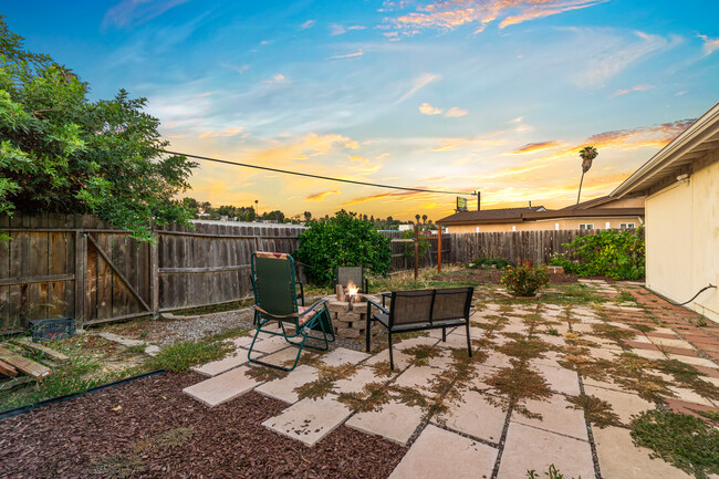 Outdoor space featuring a cozy fire pit, perfect for gathering and enjoying starry nights! - 6090 Rock St House