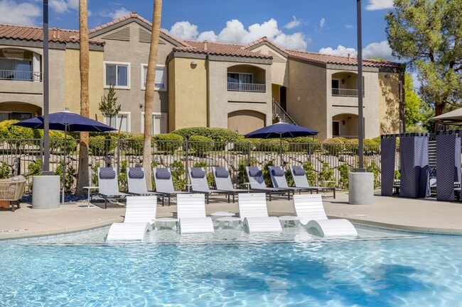 Surrounding the pool are stylish new seats and comfortable lounge chairs, perfect for soaking up the sun or unwinding with a good book. - Aviara Apartment Homes