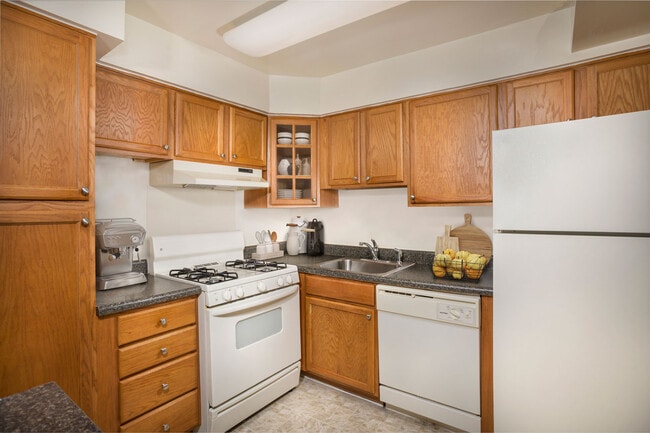Fully-equipped kitchen with pantry at Whitehall Square Apartments in Suitland, MD