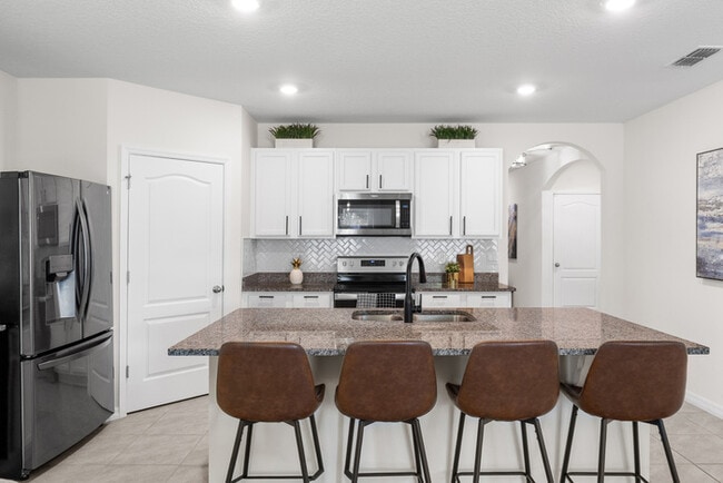 Photo - 4BR Under $2,300/mo | Tesla Charger | 15 Min to Lake Nona