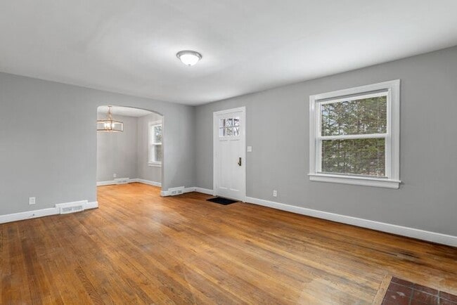 Photo - Brick home, Two Story, Hardwoods, DR, 2 Sun Rooms, FP, Carport!.