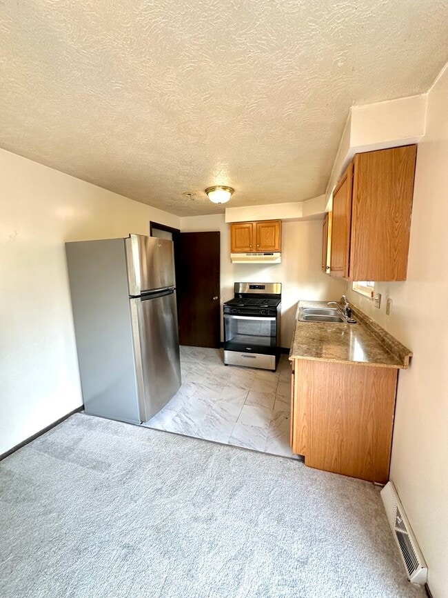 Photo - Well-Maintained 2 Bed, 1 Bath Townhome in West Mifflin - Private Balcony, Central AC & Heat - Ava...